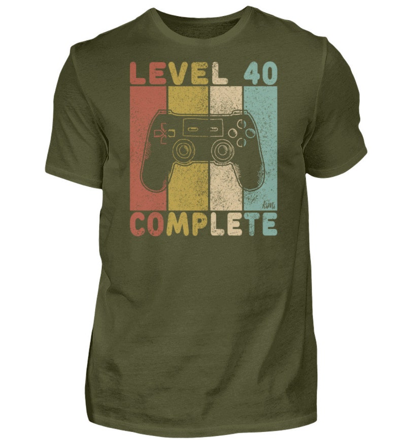 May include: A green t-shirt with a retro-style graphic of a video game controller and the text "Level 40 Complete".