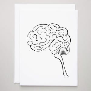 May include: A white greeting card featuring a black line drawing of a human brain. The brain illustration is a side profile, showcasing the cerebrum and brain stem. The card is blank, with a simple, minimalist design.