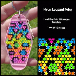 May include: Neon leopard print hotel keychain template using SS10 rhinestones. The keychain is pink and features a neon leopard print design with black, blue, green, orange, pink, and yellow rhinestones.