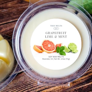 Grapefruit, Lime, Mint scented soy wax melt in a clear round container.