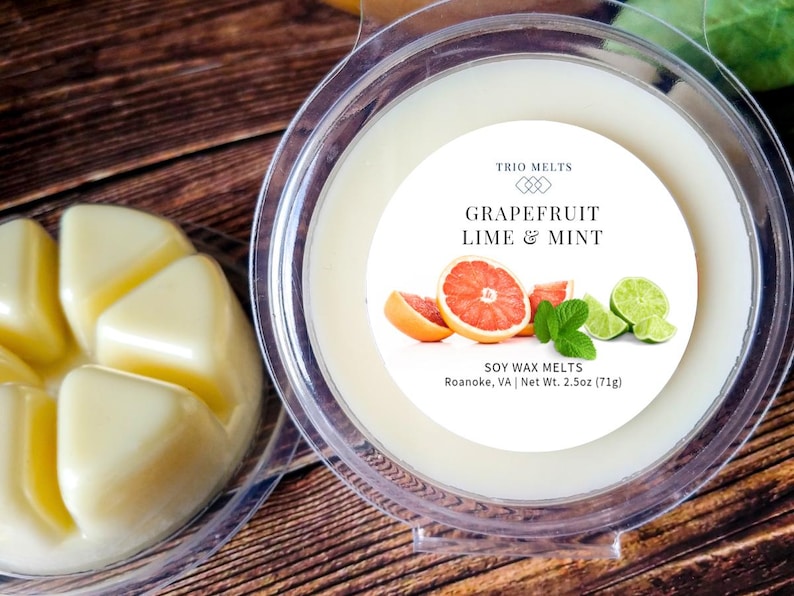 Grapefruit, Lime, Mint scented soy wax melt in a clear round container.