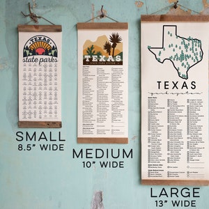 May include: Three different sizes of Texas state park posters. The posters are printed on canvas and have a wooden dowel at the top. The small poster is 8.5 inches wide, the medium poster is 10 inches wide, and the large poster is 13 inches wide.
