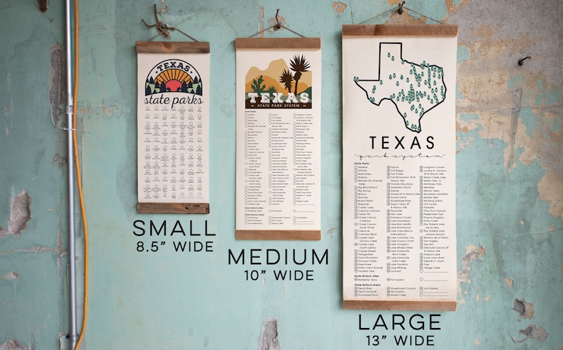 May include: Three different sizes of Texas state park posters. The posters are printed on canvas and have a wooden dowel at the top. The small poster is 8.5 inches wide, the medium poster is 10 inches wide, and the large poster is 13 inches wide.
