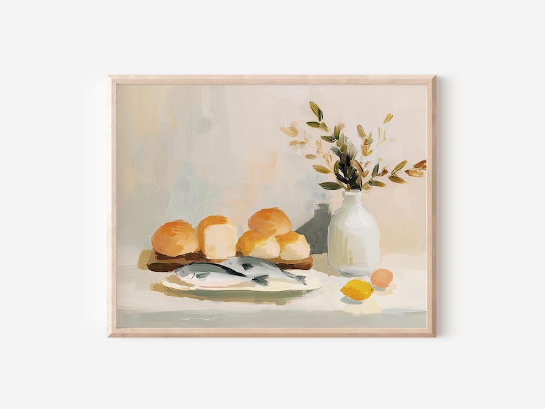 May include: A framed still life painting featuring a rustic arrangement. It depicts a wooden board with bread rolls, a plate with fish, a white vase with foliage, and a lemon. The color palette is soft, with warm tones.