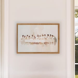 May include: A framed painting depicting a scene of the Last Supper. The painting is done in a watercolor style with muted colors and a soft, ethereal feel. The figures are dressed in white robes and are seated around a table. The painting is set against a white background.