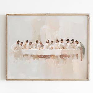 May include: A painting depicting the Last Supper, featuring Jesus and his disciples gathered around a table. The painting is done in a soft, muted palette of white, beige, and brown, with a focus on the figures and their expressions. The painting is framed in a simple, wooden frame.