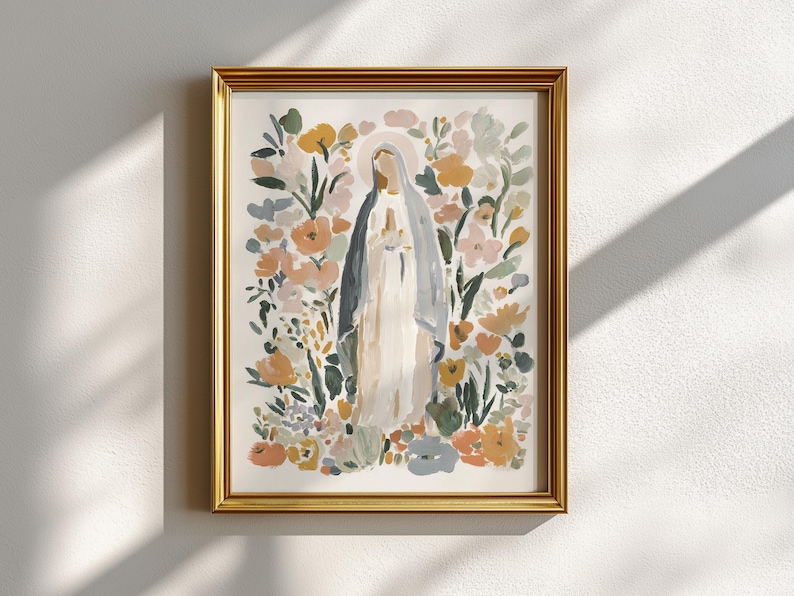 May include: Watercolor art print in a gold frame. The artwork depicts a figure in a white and blue robe, surrounded by colorful flowers in shades of peach, yellow, and green. The art has a soft, painterly style, suitable for home decor.