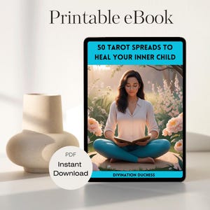 May include: A digital tablet displaying a printable ebook titled "50 Tarot Spreads to Heal Your Inner Child" by Divination Duchess. The ebook cover features a woman sitting in a garden, reading a book.