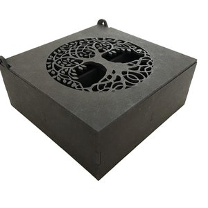 May include: A black wooden box with a tree of life design cut out of the top. The box has a hinged lid and is made of a sturdy material.