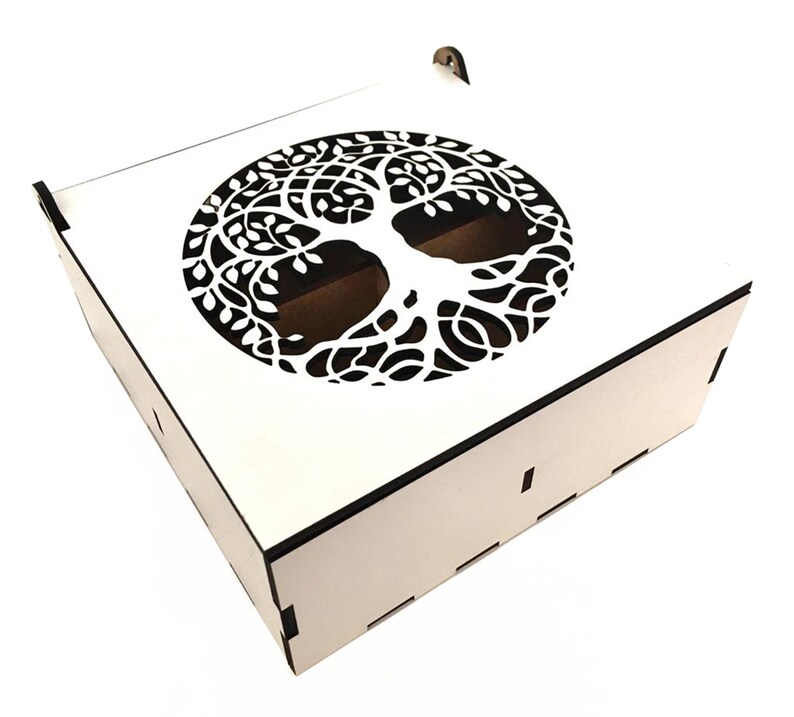 May include: White wooden box with a cutout of a tree of life design on the lid. The box has a hinged lid and a small handle.