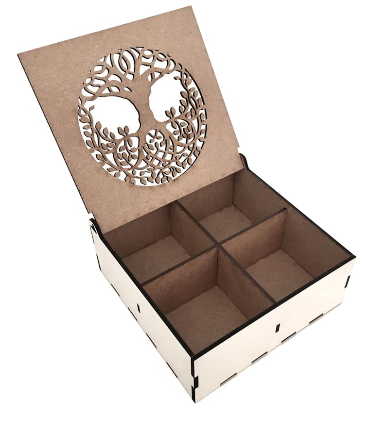 May include: A wooden box with a hinged lid featuring a cutout design of a tree of life. The box has four compartments inside.