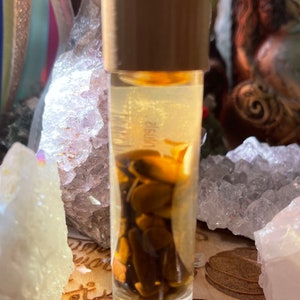 Hand Blended Crystal Infused Protection Oil/ Manifestation Oil/Essential Oil Roll on / Crystal Infused Oil / Ritual Oil/ Protective Crystals Tigers Eye