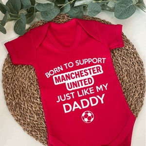 Man utd baby grow argos hot sale