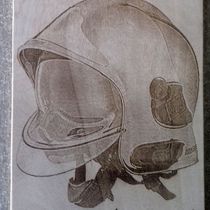 laser engraved firefighter helmet on wood