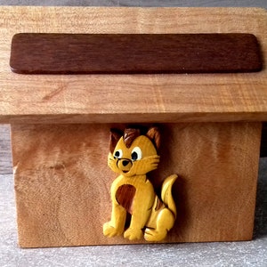 wooden cat piggy bank customizable with your first name offered in white letters stuck on top and the opening below