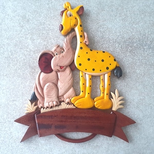 very original door plaque of the elephant and the giraffe, inscription offered