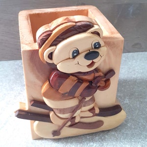 original wooden pencil holder of the skier bear