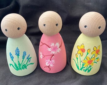 Set of three spring peg dolls