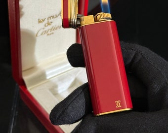 Authentic Cartier gold plated Bordeaux Chinese lacquer with intertwined rings , Paris made in 1980 ,in perfect condition, working well