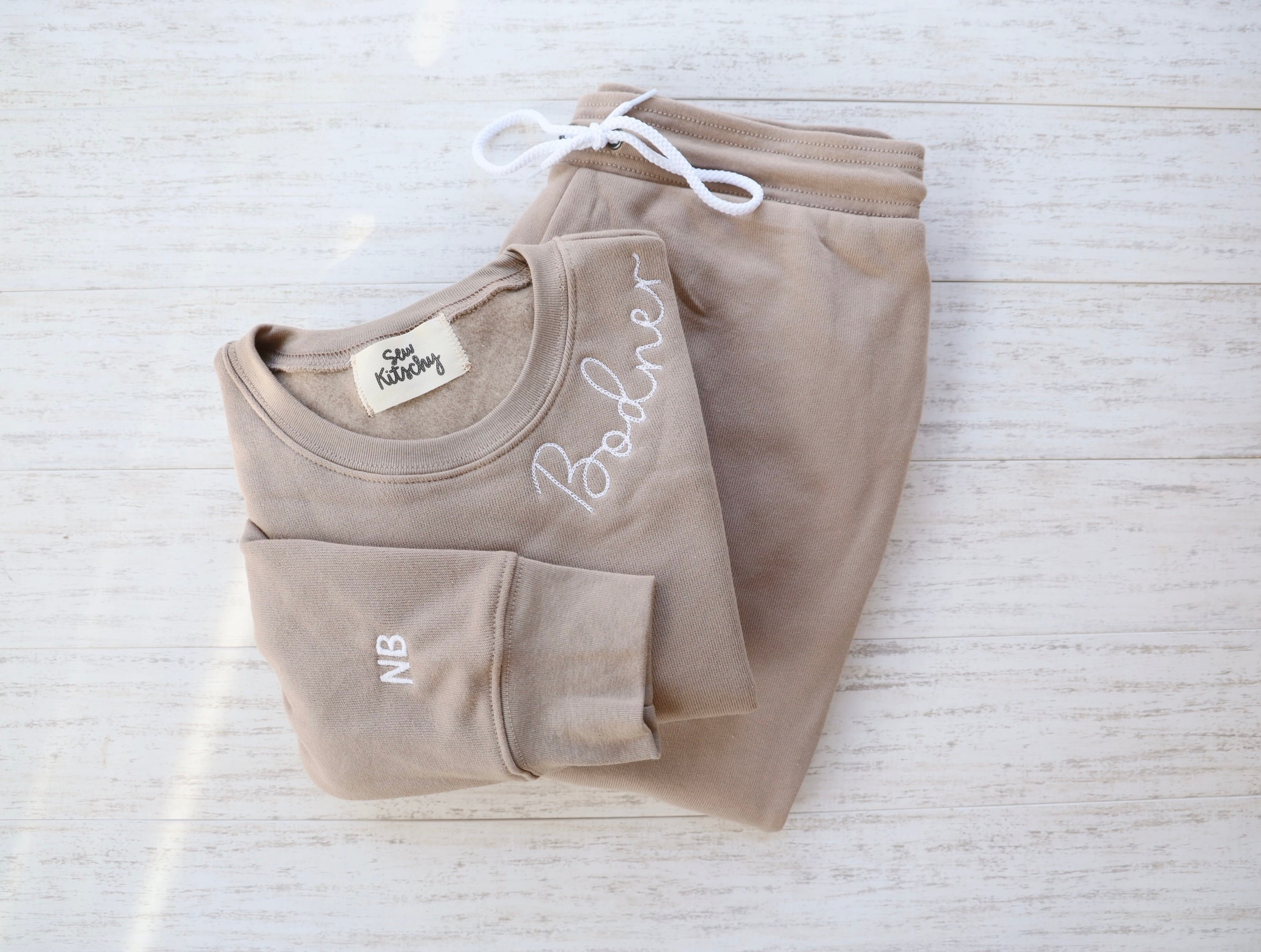 Embroidered sweat suits new arrivals