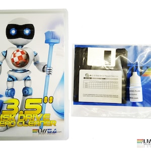 May include: A 3.5" disk drive head cleaner kit with a blue and white robot illustration on the box. The kit includes a floppy disk, a bottle of cleaning fluid, and instructions. The box has the text "3.5" Disk Drive Head Cleaner" and "AMI64.com".