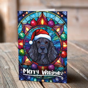 Carte de Noël Springer Spaniel noir dans un bonnet de Noel