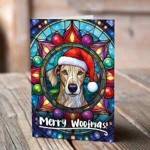 Carte de Noël Lévrier dans un bonnet de Noel