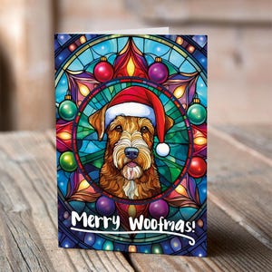 Carte de Noël Airedale Terrier dans un bonnet de Noel