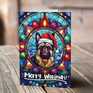 Carte de Noël Berger allemand dans un bonnet de Noel