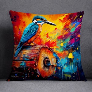 May include: A colorful abstract painting of a blue and orange kingfisher perched on a log. The background is a vibrant mix of yellow, orange, blue, and green paint splatters.