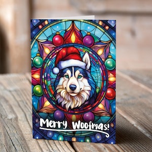 Carte de Noël Husky dans un bonnet de Noel