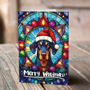 Carte de Noël Doberman dans un bonnet de Noel