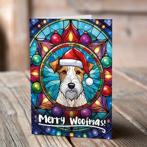 Carte de Noël Fox terrier dans un bonnet de Noel