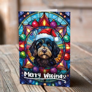 Carte de Noël Cavapoo Black dans un bonnet de Noel