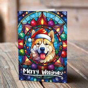 Carte de Noël Akita dans un bonnet de Noel