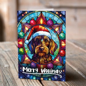 Carte de Noël Teckel à poil dur dans un bonnet de Noel