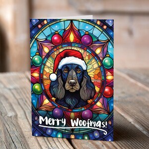 Carte de Noël Cocker noir de travail dans un bonnet de Noel