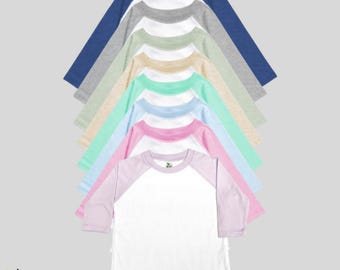 May include: A stack of ten 3/4 sleeve baseball t-shirts in various colors, including blue, gray, green, beige, light blue, pink, and white. The shirts are made of 65% polyester and 35% cotton.