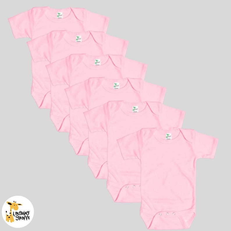 May include: Six pink baby onesies with short sleeves. The onesies are made of a soft, comfortable material and are perfect for everyday wear.