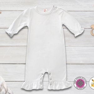 May include: White baby onesie with long sleeves and a ruffled hem. The onesie has a snap closure at the bottom and is made of 100% interlock knit polyester.