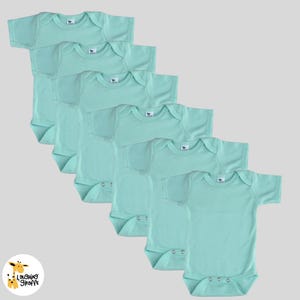 May include: Six mint green baby onesies with short sleeves and snap closures. The onesies are arranged in a stack, with the top onesie at the top of the image and the bottom onesie at the bottom of the image.