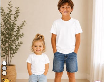 May include: A plain white short-sleeved crew neck t-shirt made of 100% polyester. The shirt features a standard fit with a straight hemline and is shown in two sizes, one for a smaller child and one for an older child, both paired with denim shorts.