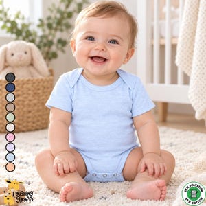 May include: A light blue short-sleeved baby bodysuit featuring a round neckline and a snap-button closure at the bottom. The fabric is a blend of 65% polyester and 35% cotton. A vertical column of ten circular color swatches is displayed on the left.
