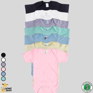 May include: A set of ten baby onesies in various colors, including black, white, gray, pink, light blue, and mint green. The onesies are made of a soft, comfortable fabric and are perfect for everyday wear.  The onesies are made of 65% polyester and 35% cotton.