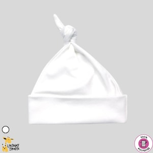 May include: White baby hat with a knot on top. The hat is made of 100% polyester.