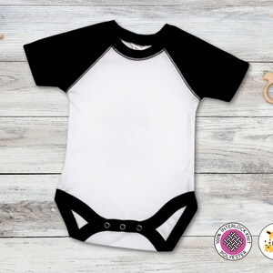 May include: White baby onesie with black raglan sleeves and black trim. The onesie has three snaps at the bottom.