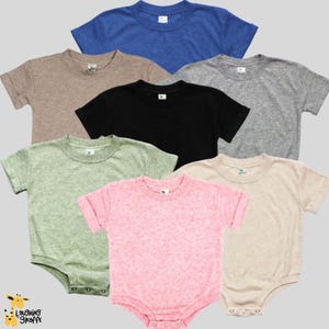 May include: Six different colored baby onesies, including blue, brown, black, green, pink, and beige. The onesies are all short-sleeved and have a crew neck.