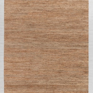 May include: A brown woven rug with a subtle striped pattern. The rug is 8 feet by 10 feet and measures 240 centimeters by 300 centimeters.