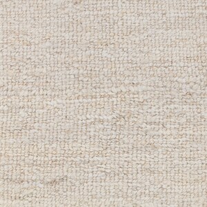 May include: Close-up of a white, textured fabric with a woven pattern. The fabric has a soft, fuzzy texture.