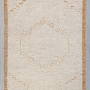 May include: A beige and brown rug with a geometric pattern. The rug is 8x10 feet, or 240x300 centimeters.